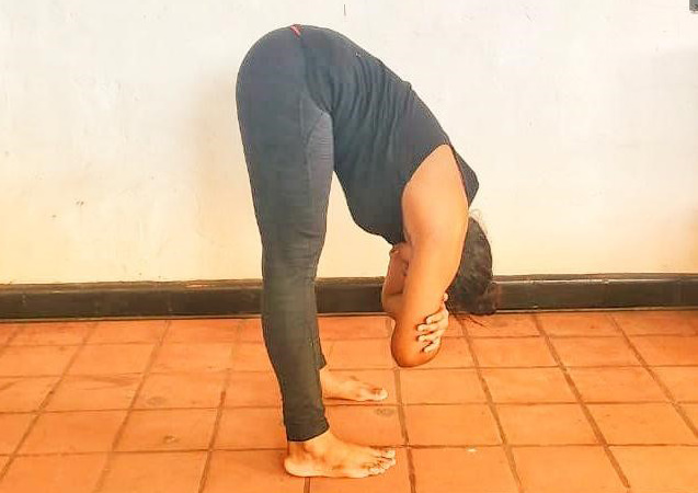 2.Standing Forward Fold With Clasped Elbows